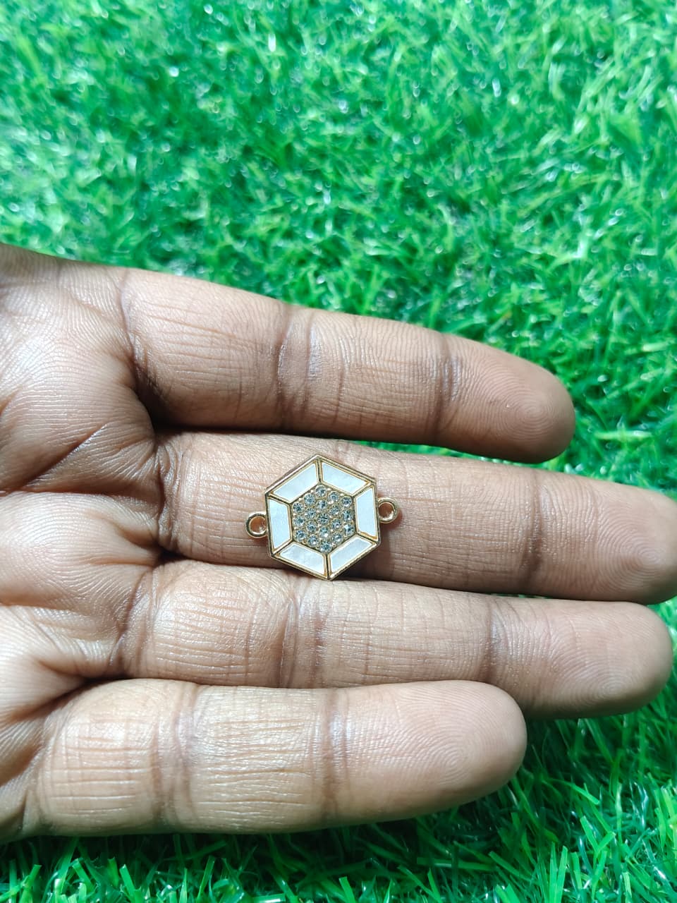 Nagneshi Elegant Rakhi Charm Hexagonal Gold Frame with American Diamond & Mother-of-Pearl Inlay
