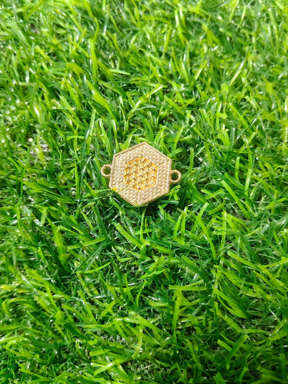 Nagneshi Elegant Rakhi Charm Hexagonal Gold Frame with American Diamond & Mother-of-Pearl Inlay
