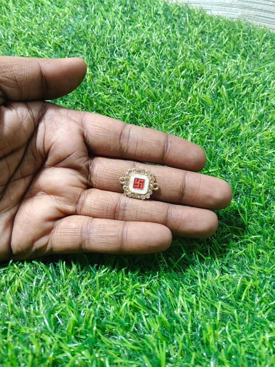 Nagneshi Rakhi Charm Octagonal Gold Frame with Auspicious Swastik Motif & American Diamond Border